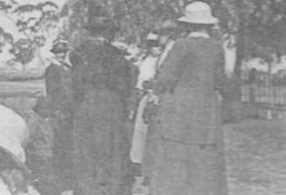 A picture containing photo, text, newspaper, building
Description automatically generated